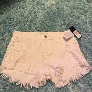 White GUESS jean shorts with crochet detailing
